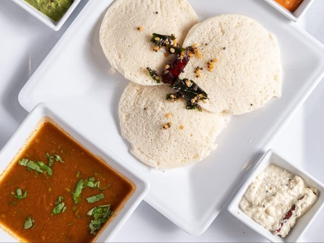 Plain Idli with Sambhar and Chutney.